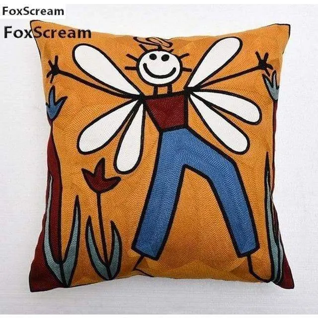 Housse de coussin brodée géométrique